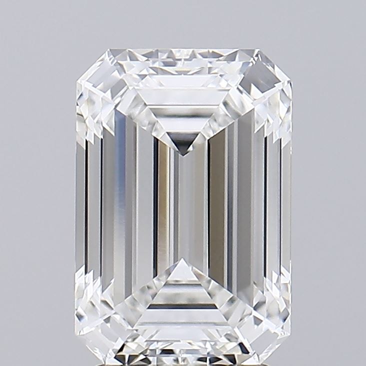 2.96 Emerald-cut diamond with sharp facets and a rectangular shape, reflecting light against a neutral gray background, exuding elegance and luxury.