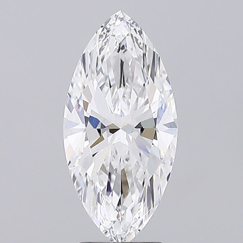 3 A marquise cut diamond with sparkling faceted surfaces on a grey background.