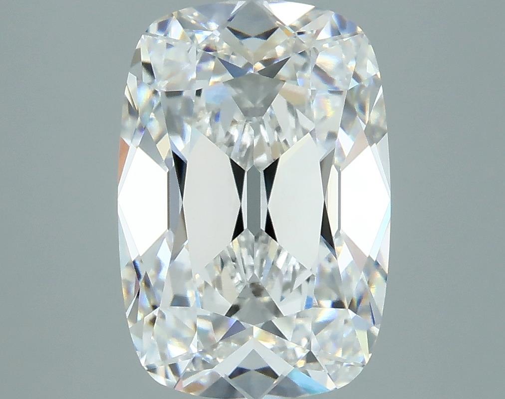 3.03 A sparkling, cut diamond with a rectangular cushion shape, displaying brilliant facets and clarity against a soft gray background.