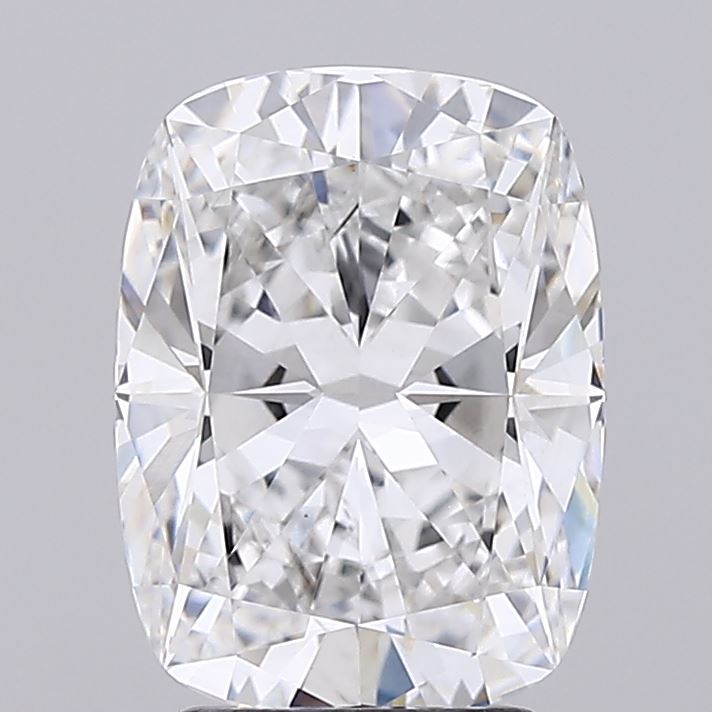 3.04 A radiant, cushion-cut diamond sparkles with clarity, showcasing intricate facets and bright reflections against a soft gray background.
