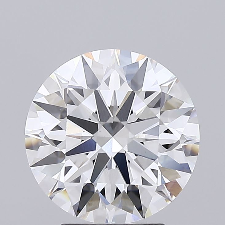 3.08 Round brilliant-cut diamond with intricate facets reflecting light, creating a sparkling effect. The background is plain gray, emphasizing the gem's clarity.