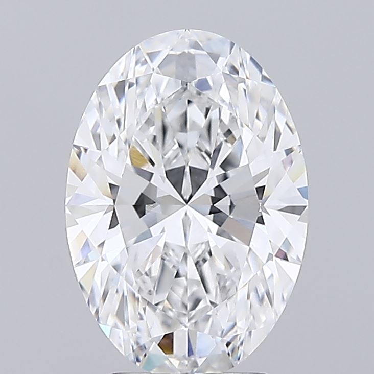 3.09 Oval-shaped diamond with brilliant facets, reflecting light in rainbow colors against a gray background, conveying elegance and luxury.