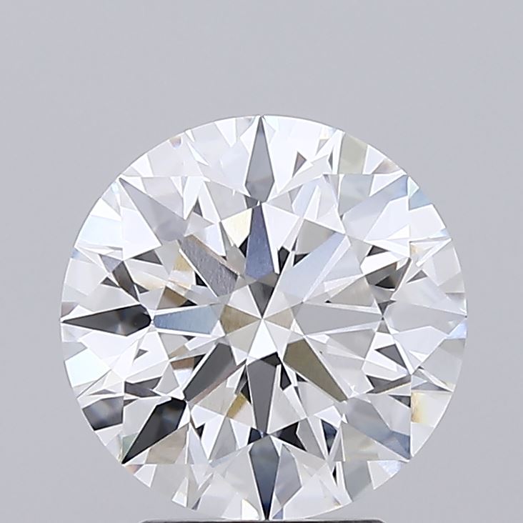 3.09 A sparkling round-cut diamond on a gray background, displaying intricate geometric facets and a brilliant shine, conveying elegance and luxury.