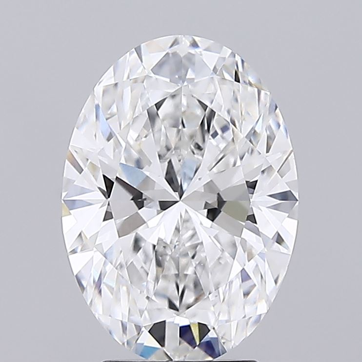 3.22 A sparkling oval-cut diamond with intricate facets reflects light brilliantly against a plain gray background, conveying elegance and sophistication.