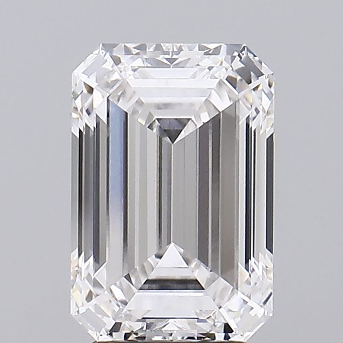 3.38 Emerald-cut diamond with brilliant facets, showcasing clarity and radiant shine against a soft gray background.
