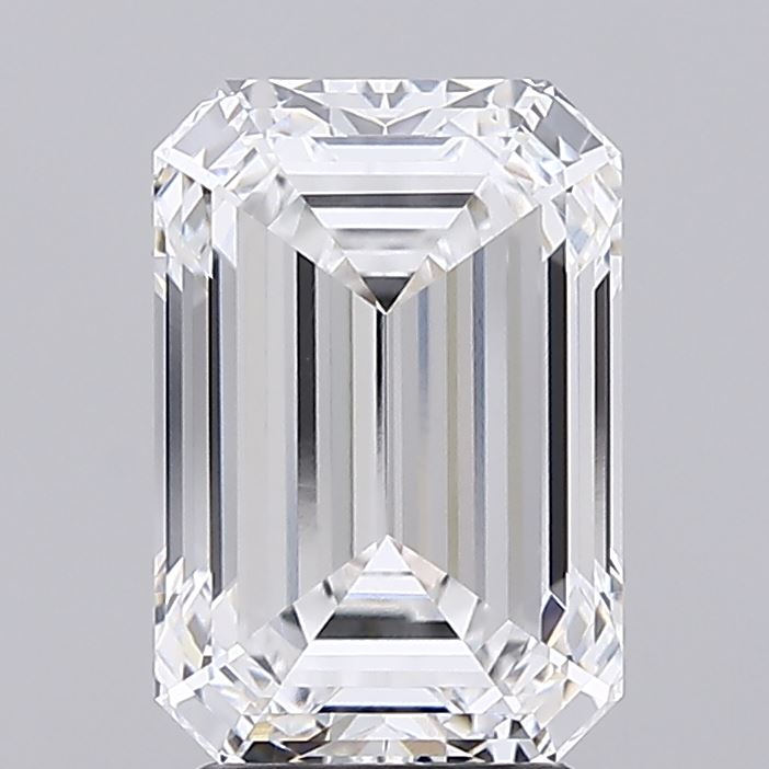 3.38 A sparkling, clear emerald-cut diamond with sharp edges and intricate faceting, reflecting light beautifully against a gray background.