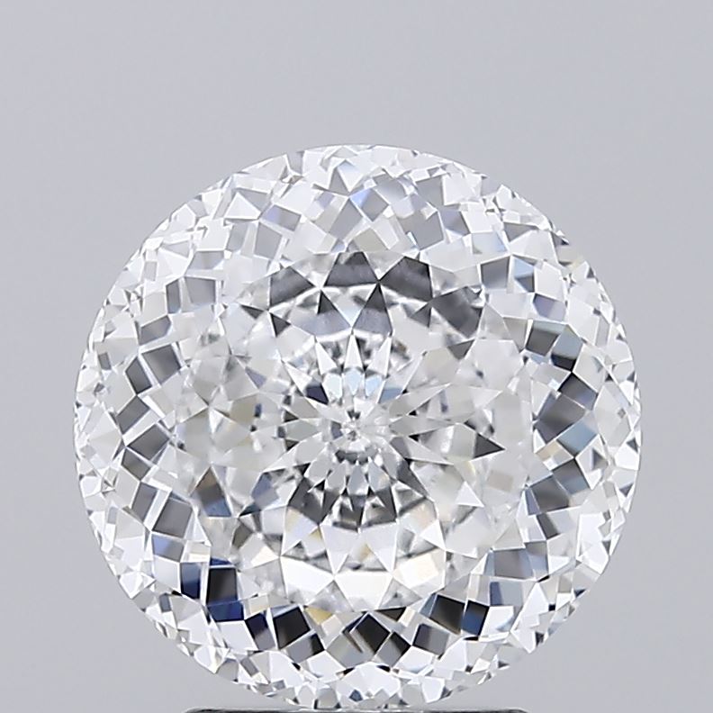 3.4 Close up of a round brilliant cut diamond against a grey background.