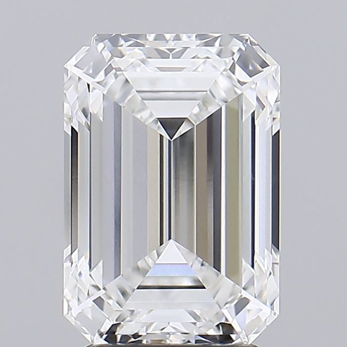 3.51 A close-up of a sparkling, clear, rectangular-cut diamond, showcasing its intricate facets and brilliance against a soft gray background.