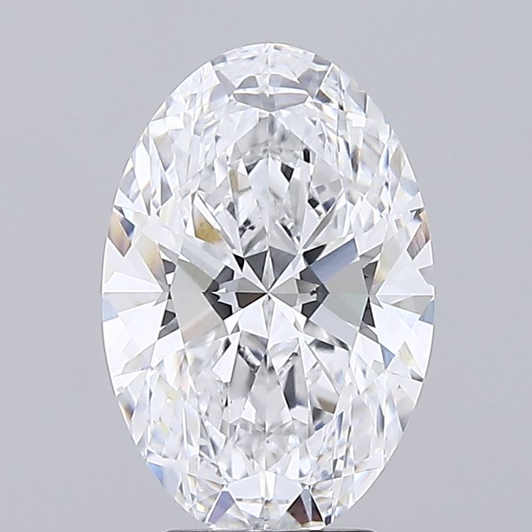 3.52 Oval-shaped diamond with intricate cuts and facets, reflecting light brilliantly against a neutral gray background. The image conveys elegance.