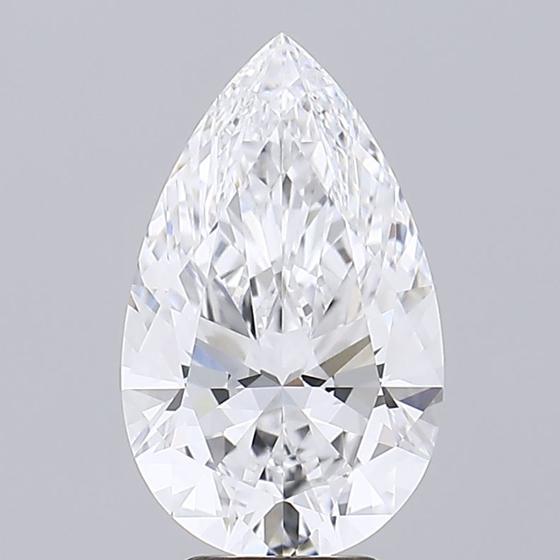 3.52 A pear-shaped diamond with intricate facets reflects light, creating a sparkling effect against a plain gray background, exuding elegance and luxury.