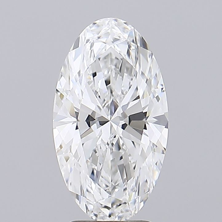 3.56 A brilliant, oval-cut diamond glimmers with numerous facets, reflecting light against a soft gray background.