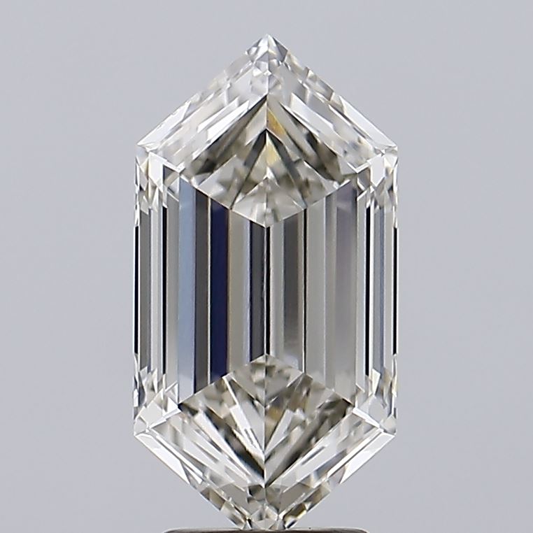 3.59 Close-up of an emerald-cut diamond with sharp facets and a glossy surface, reflecting light. The background is a soft gray, emphasizing the gem's brilliance.