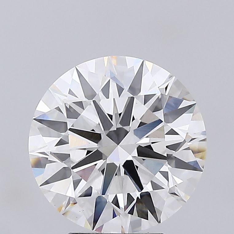 3.71 Close-up of a round brilliant cut diamond against a light grey background.