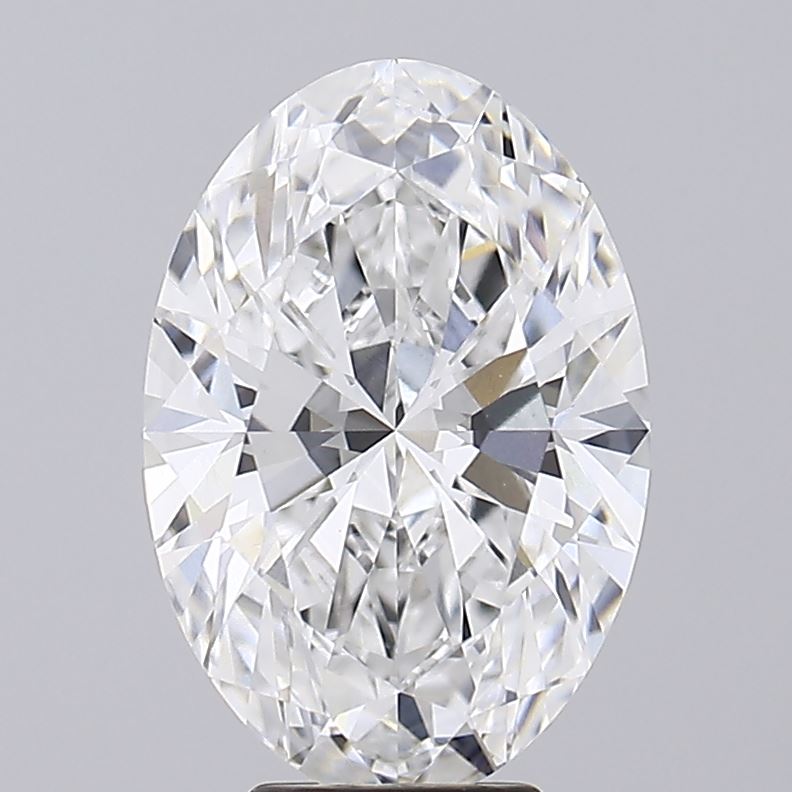 5.99 A close up of a sparkling oval cut diamond against a grey background.