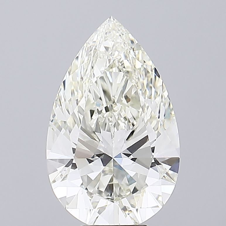 8.05 Close-up of a sparkling, pear-shaped diamond, showcasing its brilliant facets and clarity against a light gray background.