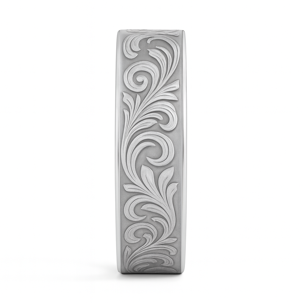 Decorative silver bar with intricate floral patterns on a white background
