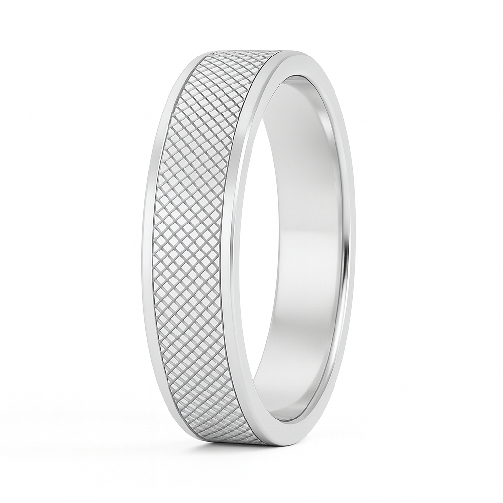 Silver ring with textured pattern on a white background