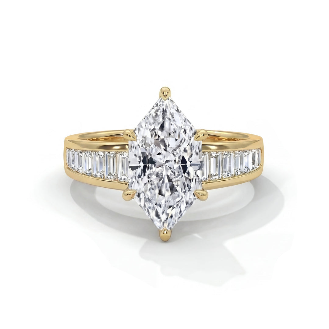 Gold ring with a large marquise-shaped diamond and smaller baguette diamonds on a white background