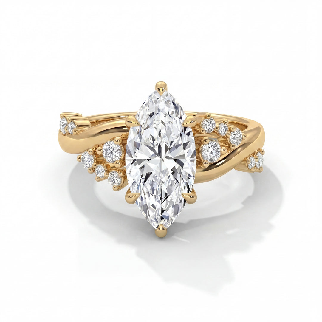 Eden Setting in 14K Yellow Gold with marquise-cut center stone and scattered diamond twisted band