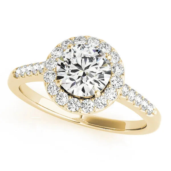 Gold diamond ring with a halo setting on a white background.