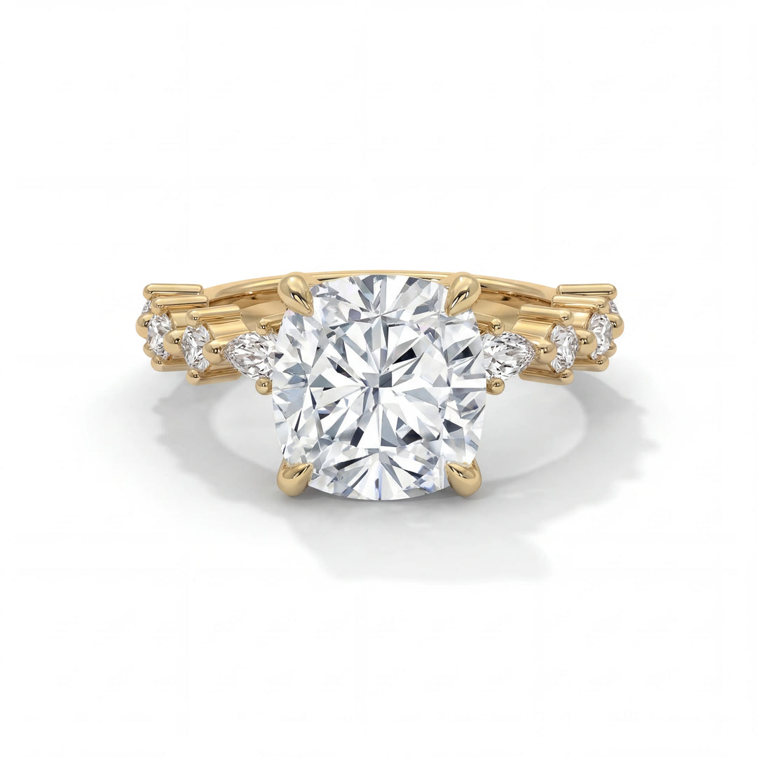 Gold ring with a large diamond and smaller diamonds on the band against a white background