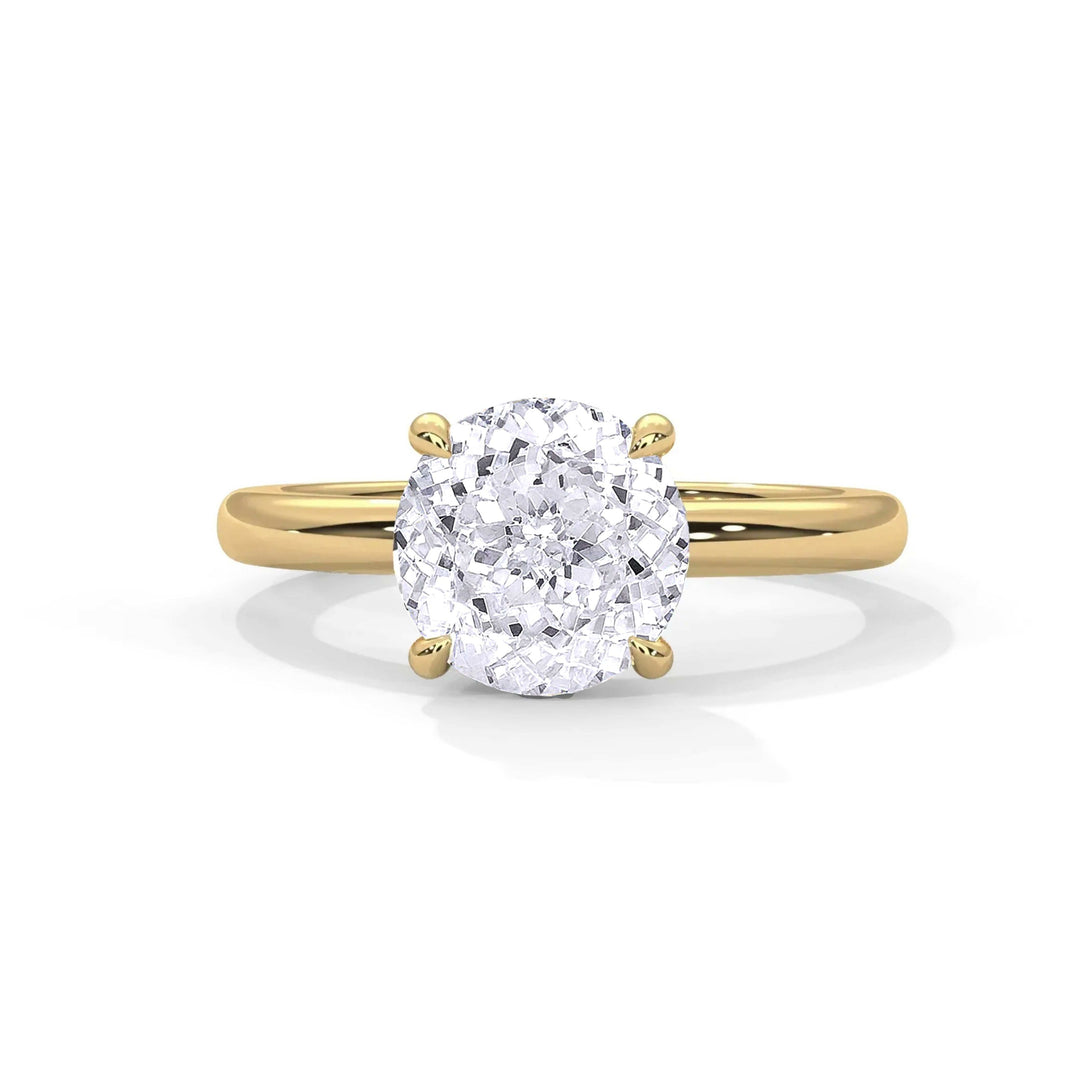 Classic Solitaire Setting engagement ring with a round diamond in a 14k yellow gold minimalist band handcrafted in NYC's diamond district