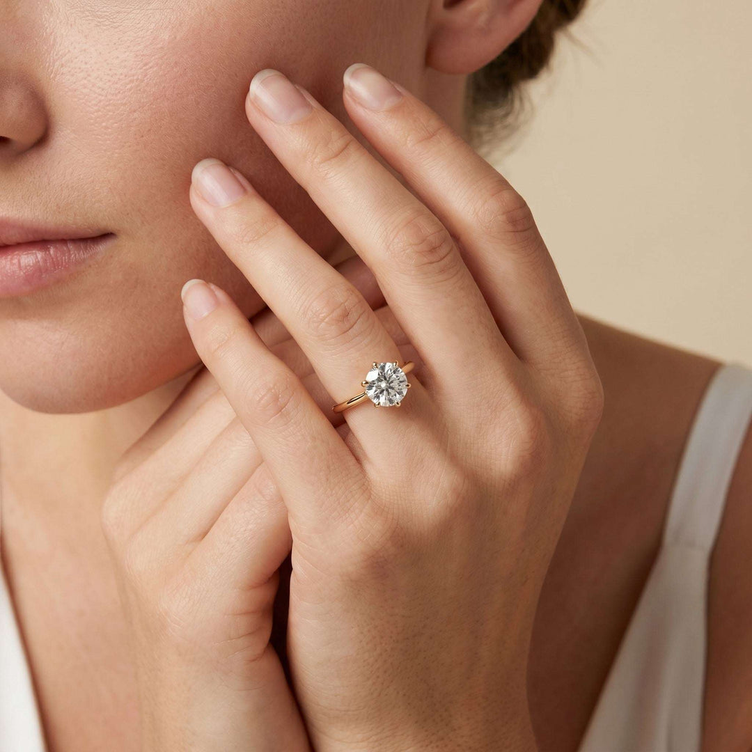 Close-up of Tapered Cathedral Setting engagement ring showcasing elevated center diamond and elegant design