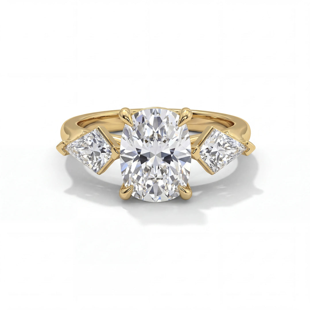 Gold ring with a large central diamond and two smaller diamonds on the sides on a white background