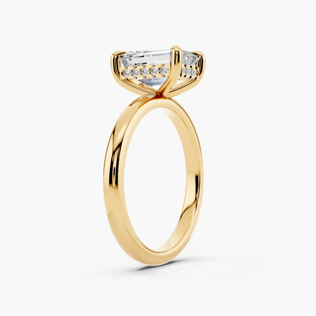Venetian Hidden Halo Setting Emerald cut engagement ring in yellow gold persp