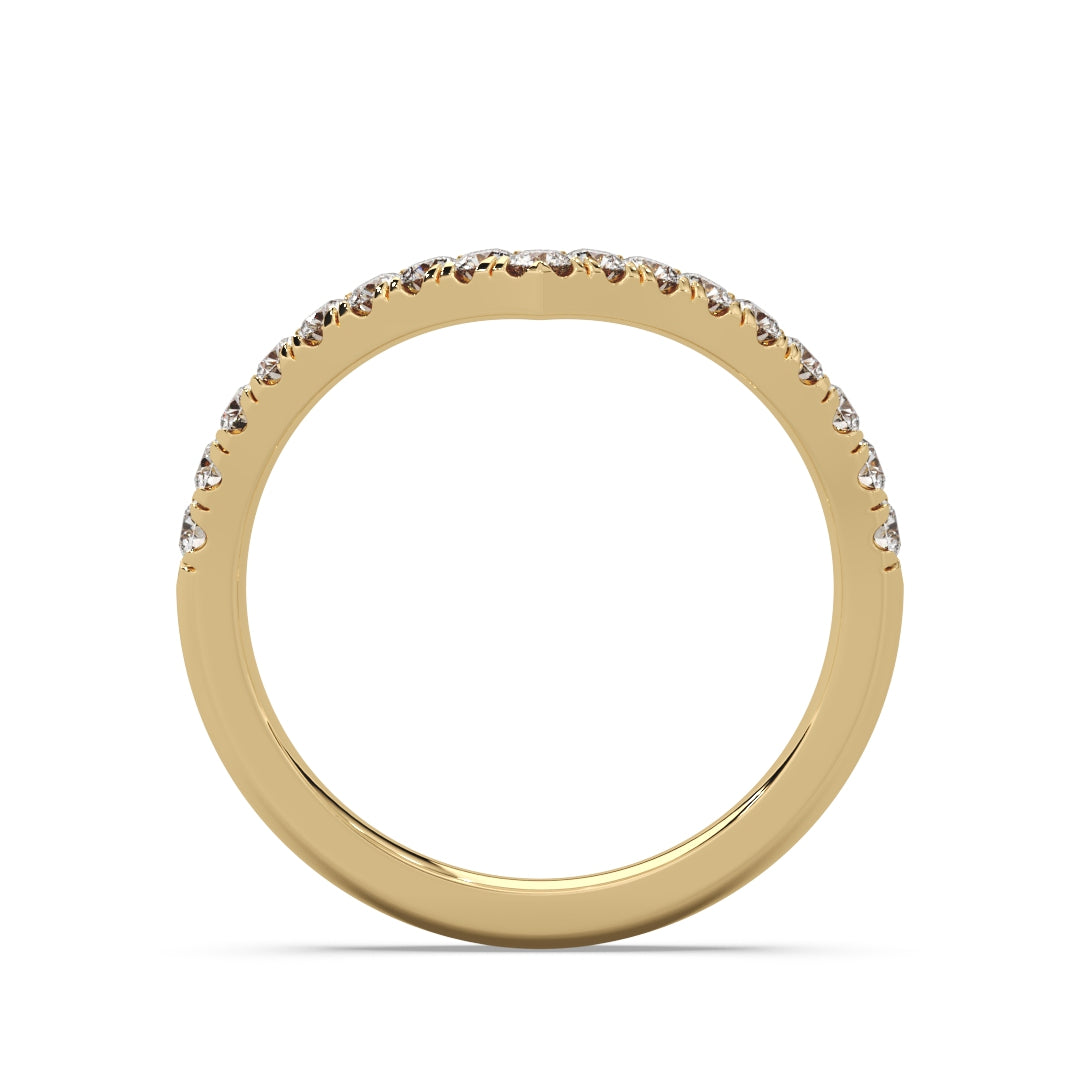 Elegant gold ring with small diamonds encrusted along the top curve, set against a plain white background, conveying luxury and sophistication.