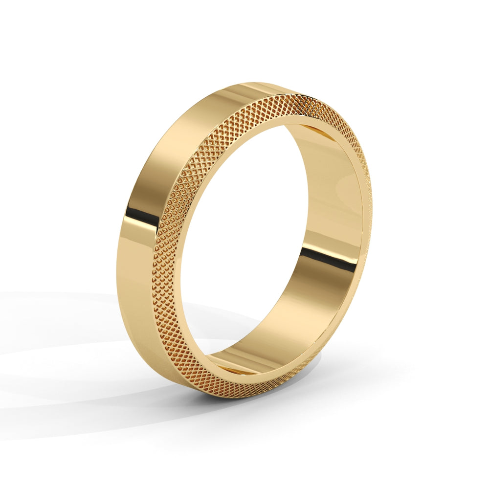 Gold ring with textured band on a white background