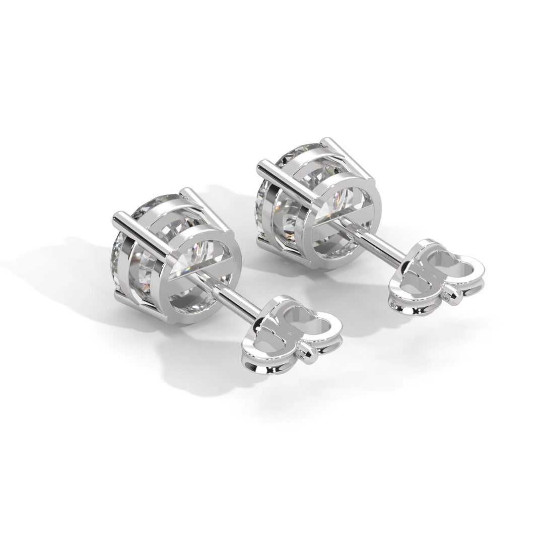 A beautiful pair of diamond stud earrings sparkling elegantly against a soft background.