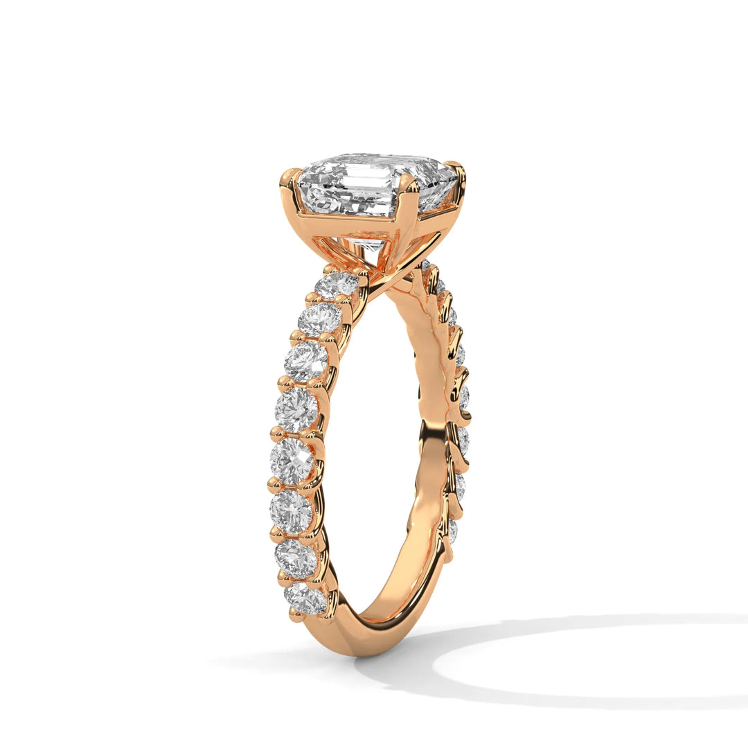 An elegant asscher diamond engagement ring crafted in 14k rose gold, highlighted by a bubble setting for a captivating 3D appearance.