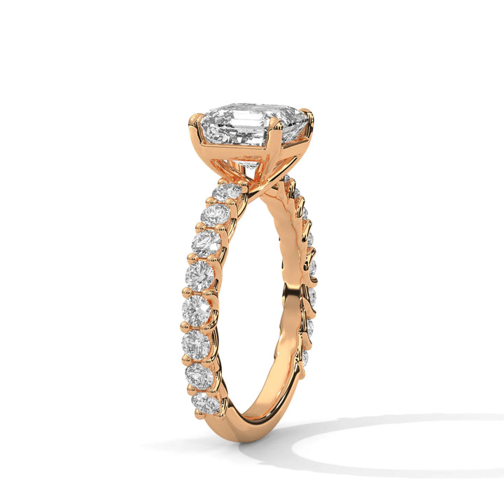 An elegant asscher diamond engagement ring crafted in 14k rose gold, highlighted by a bubble setting for a captivating 3D appearance.