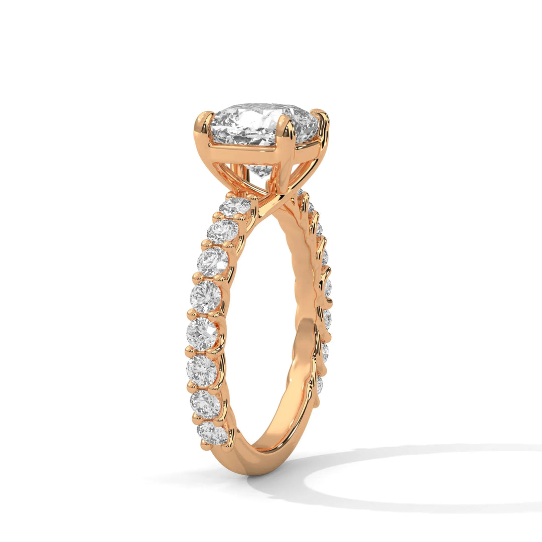 An elegant cushion diamond engagement ring crafted in 14k rose gold, highlighted by a bubble setting for a captivating 3D apcushionance.