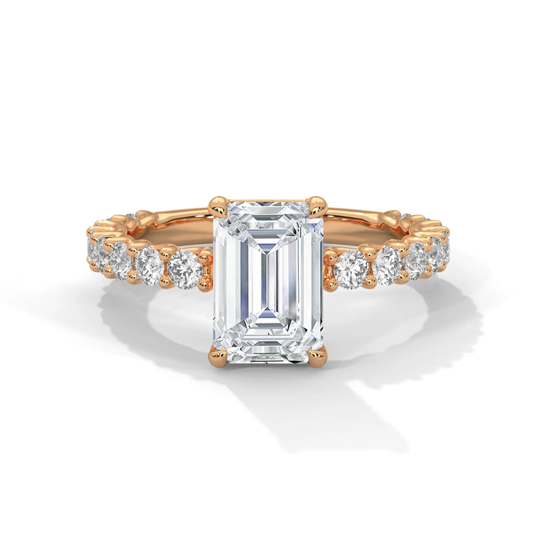 A stunning emerald cut diamond engagement ring in a bubble setting, crafted from 14k rose gold for a luxurious touch.