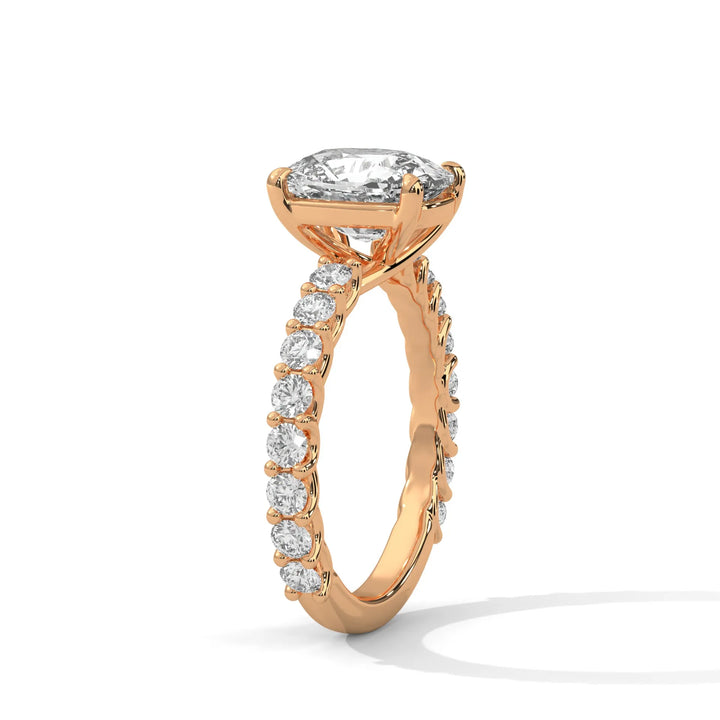 An elegant long cushion diamond engagement ring crafted in 14k rose gold, highlighted by a bubble setting for a captivating 3D appearance.