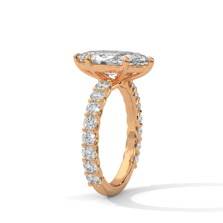 An elegant marquise diamond engagement ring crafted in 14k rose gold, highlighted by a bubble setting for a captivating 3D appearance.