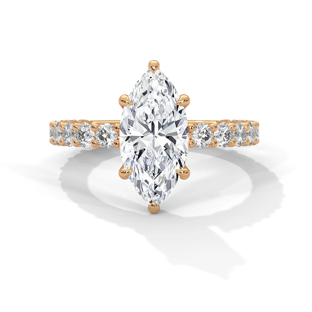 A stunning marquise cut diamond engagement ring in a bubble setting, crafted from 14k rose gold for a luxurious touch.