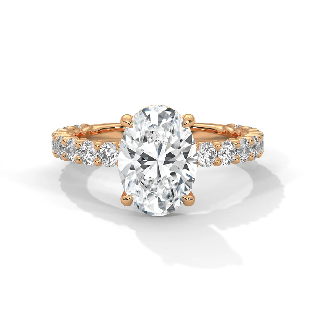 A stunning oval cut diamond engagement ring in a bubble setting, crafted from 14k rose gold for a luxurious touch.