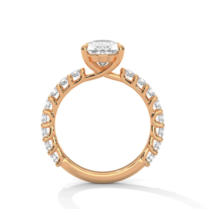 An elegant pear diamond engagement ring crafted in 14k rose gold, highlighted by a bubble setting for a captivating 3D appearance.