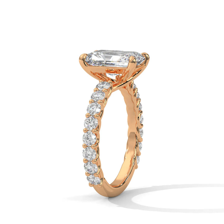 An elegant radiant diamond engagement ring crafted in 14k rose gold, highlighted by a bubble setting for a captivating 3D appearance.