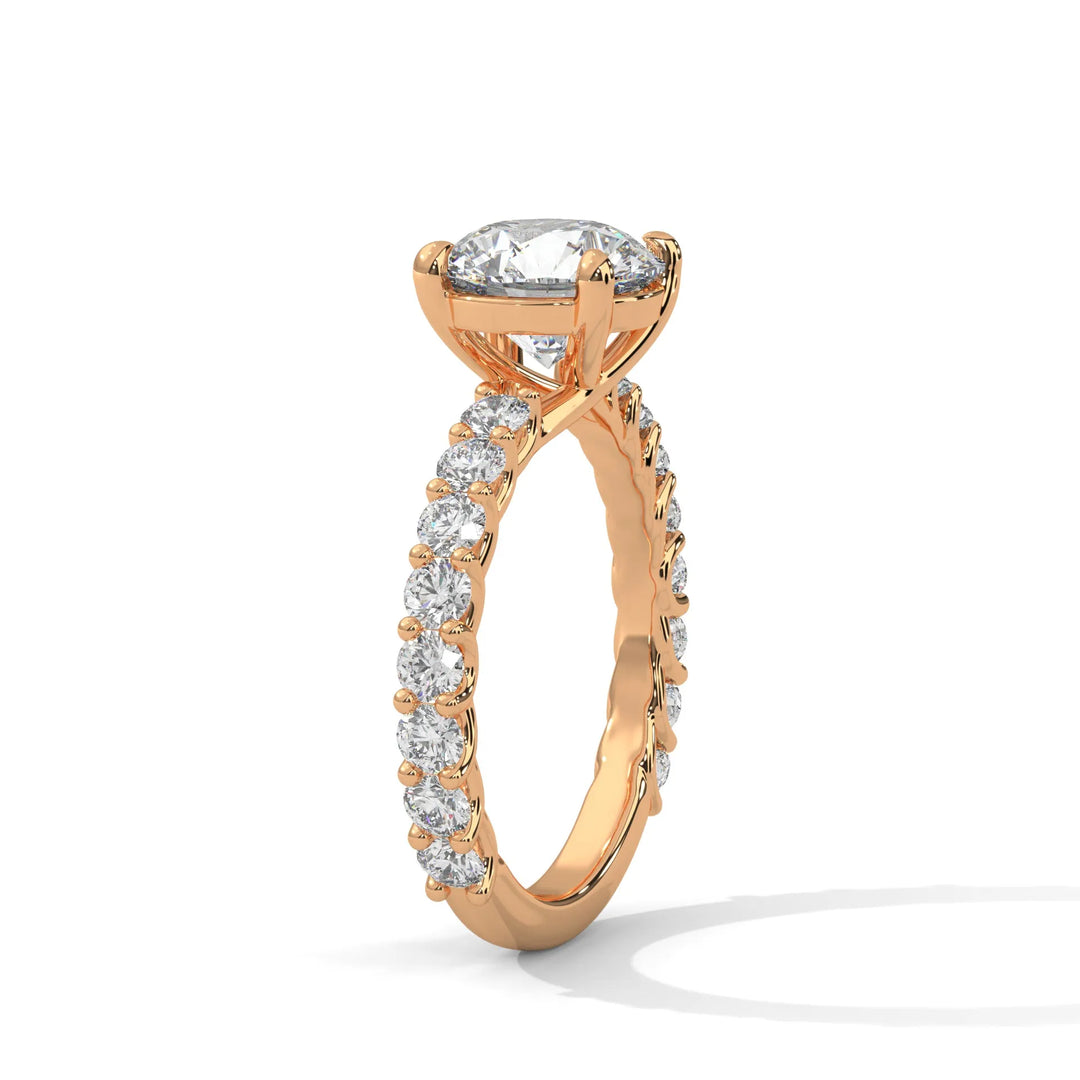 An elegant round diamond engagement ring crafted in 14k rose gold, highlighted by a bubble setting for a captivating 3D appearance.