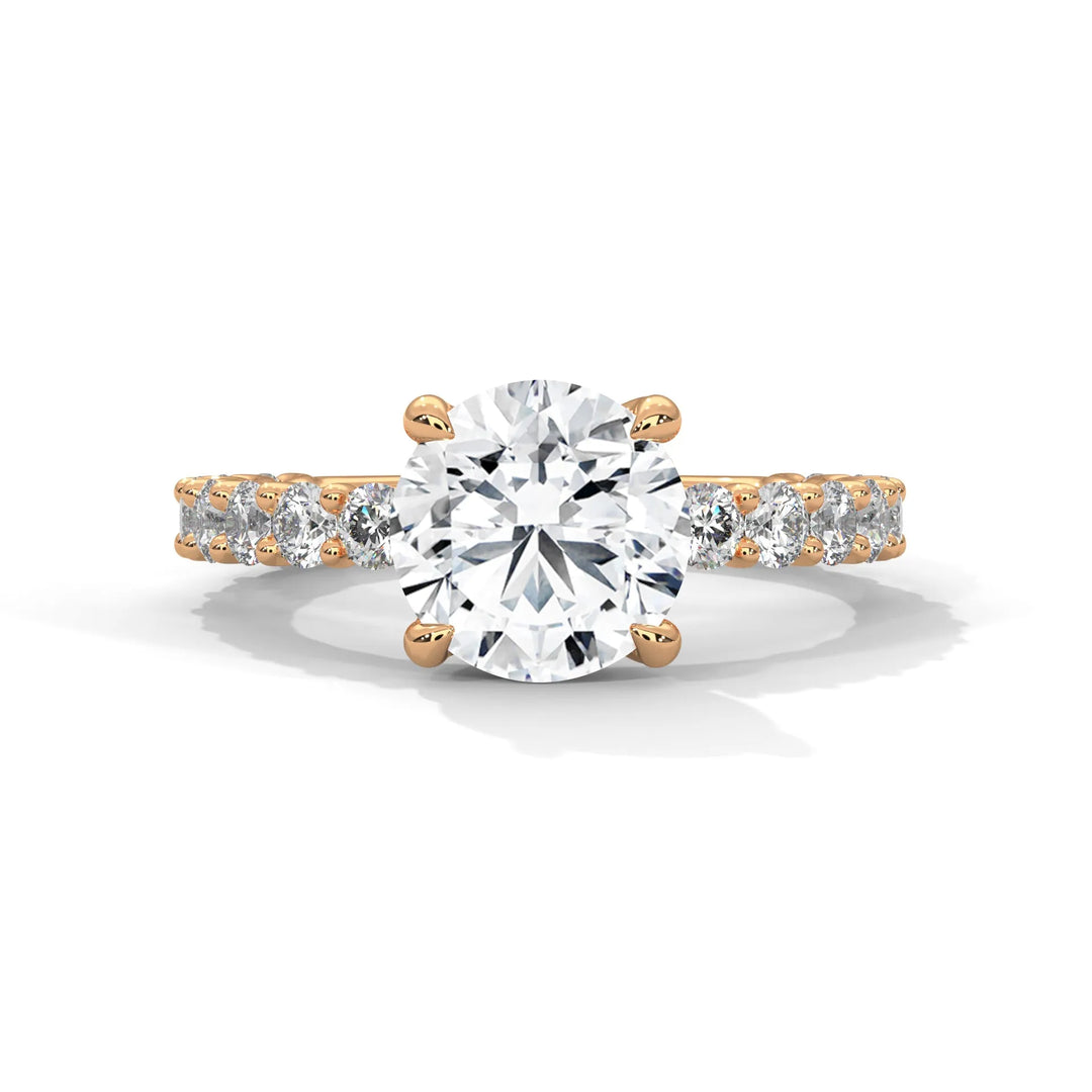 A stunning round cut diamond engagement ring in a bubble setting, crafted from 14k rose gold for a luxurious touch.