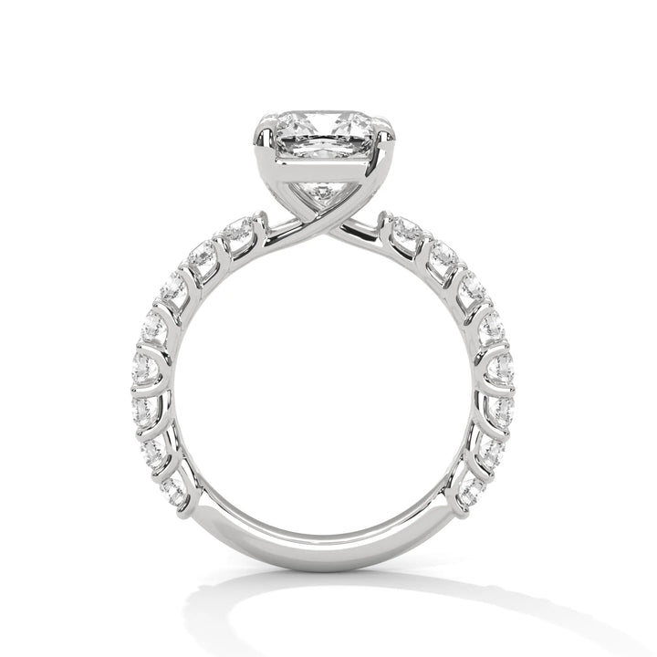 A white gold engagement ring with a diamond center in a bubble setting, crafted from 14k gold and featuring an cushion shape.