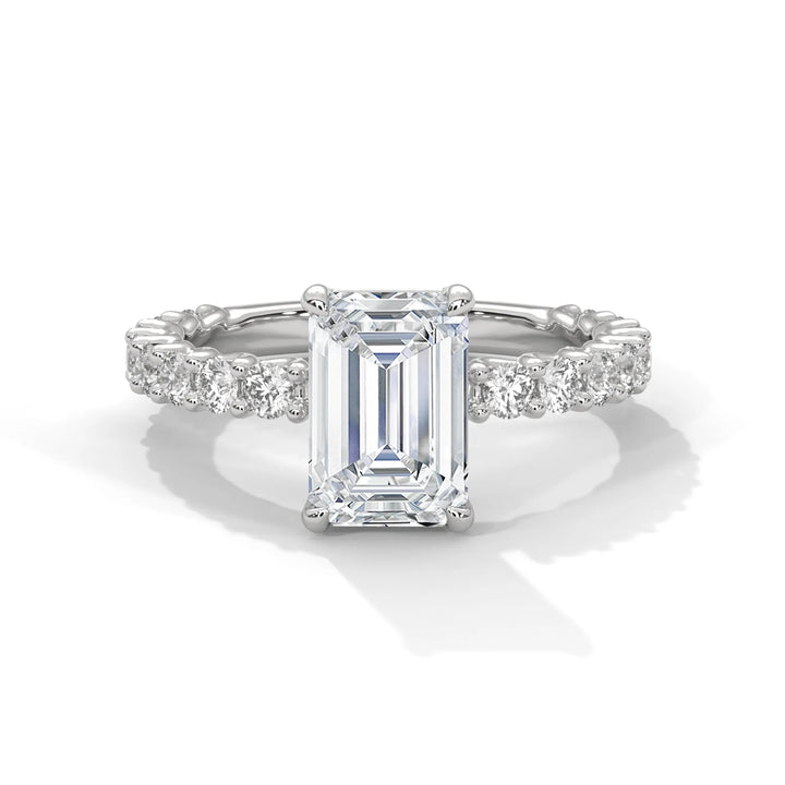 A stunning emerald cut diamond engagement ring in a bubble setting, crafted from 14k white gold for a luxurious touch.