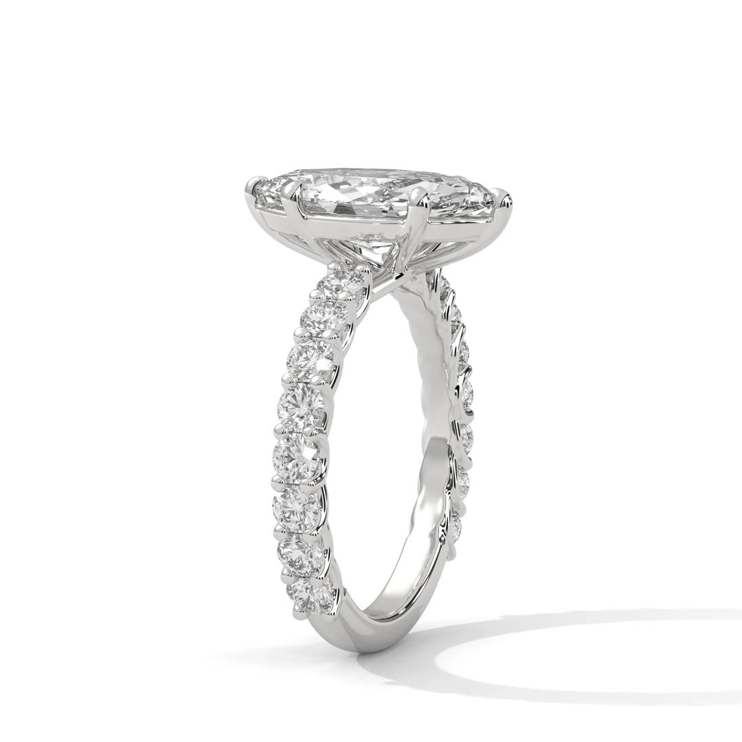 An elegant marquise diamond engagement ring crafted in 14k white gold, highlighted by a bubble setting for a captivating 3D appearance.