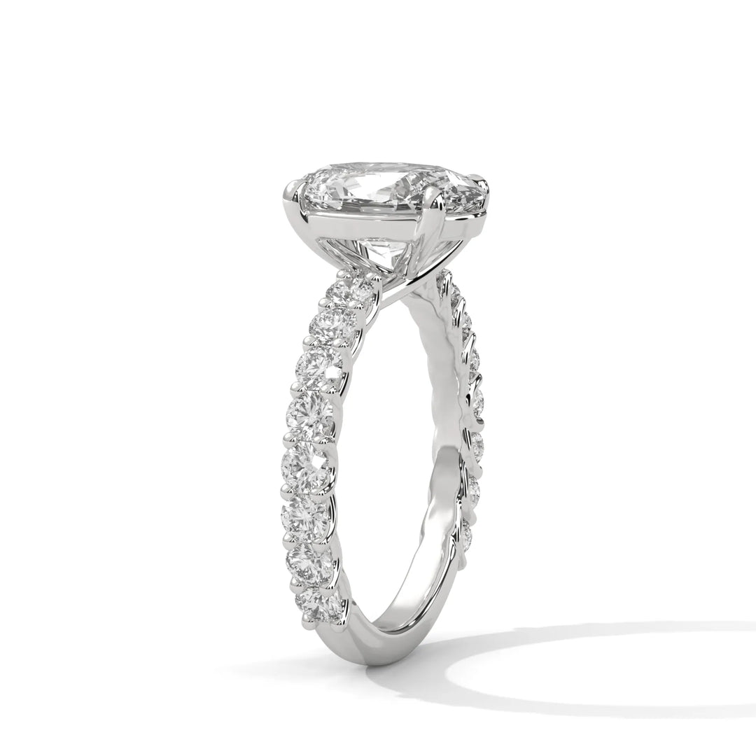 An elegant oval diamond engagement ring crafted in 14k white gold, highlighted by a bubble setting for a captivating 3D appearance.