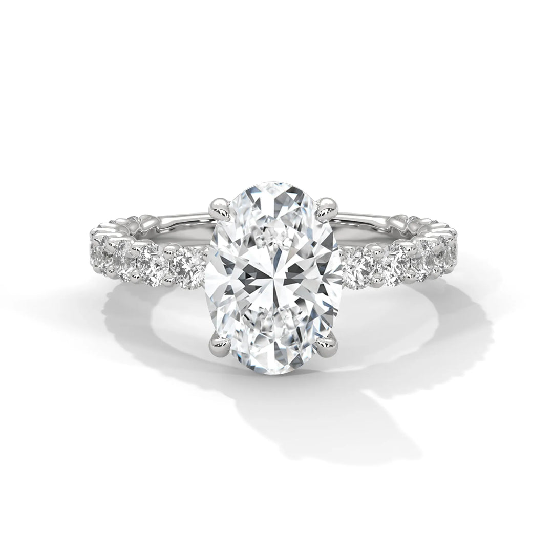 A stunning oval cut diamond engagement ring in a bubble setting, crafted from 14k white gold for a luxurious touch.