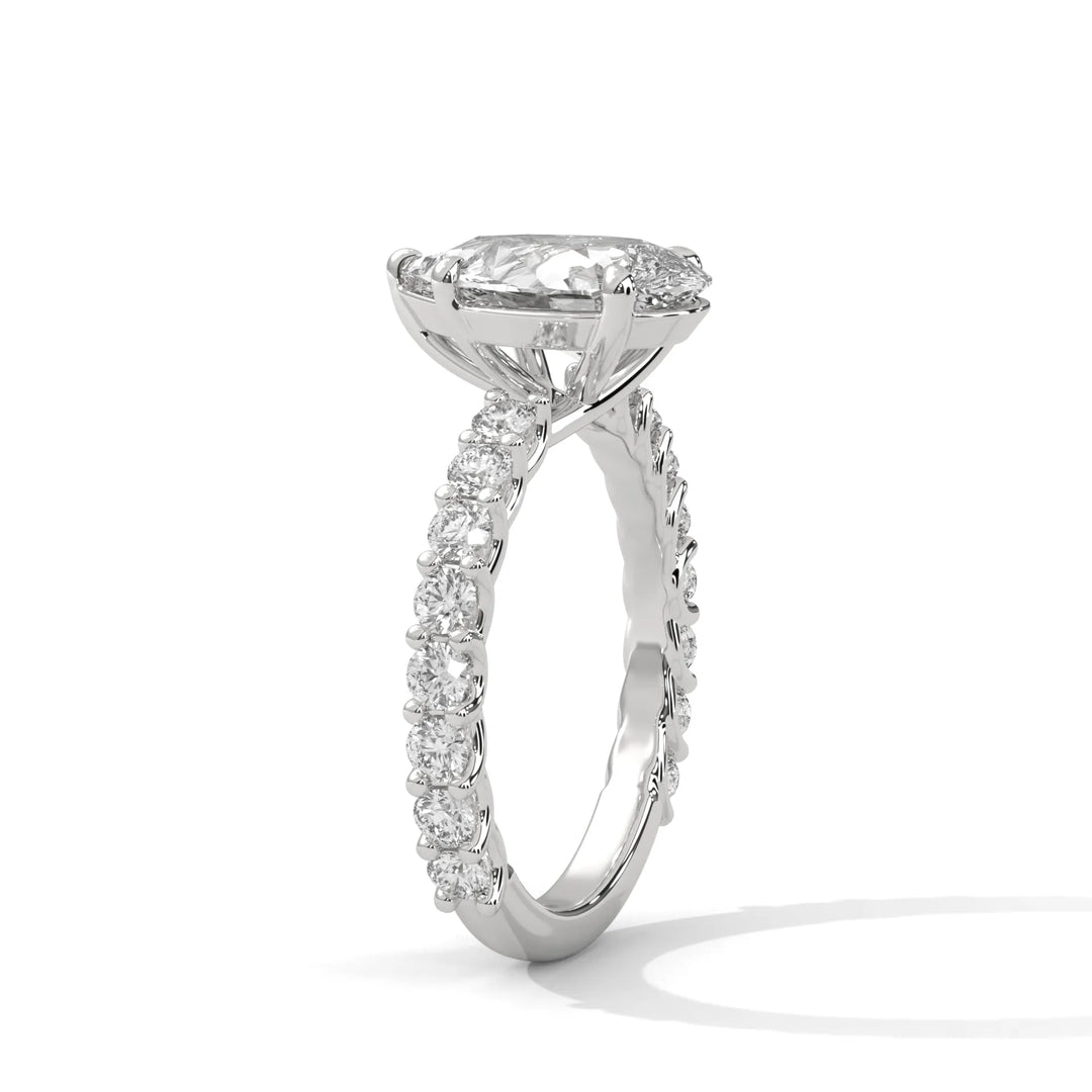 An elegant pear diamond engagement ring crafted in 14k white gold, highlighted by a bubble setting for a captivating 3D appearance.